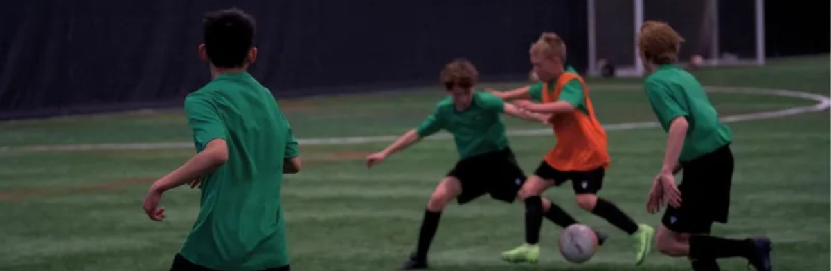 teenagers playing football
